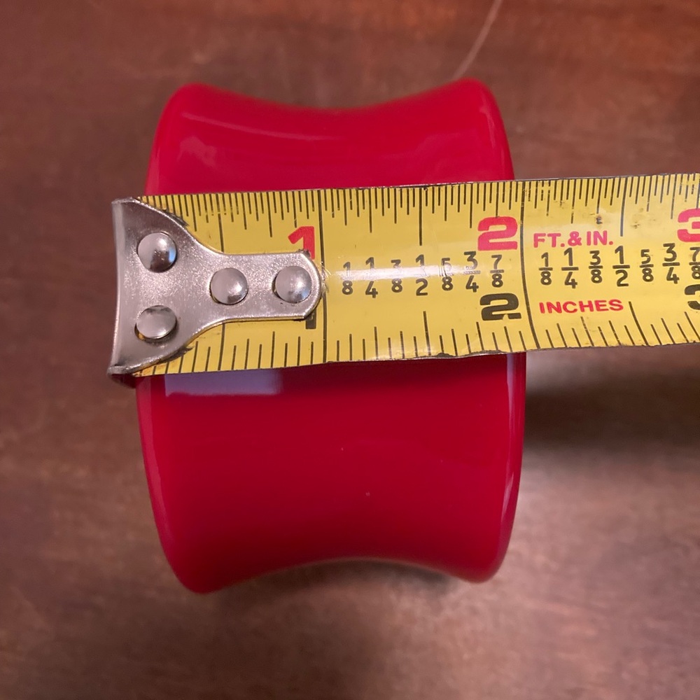 Beautiful red resin bangle  by Iris Apfel. Wore it a few times.